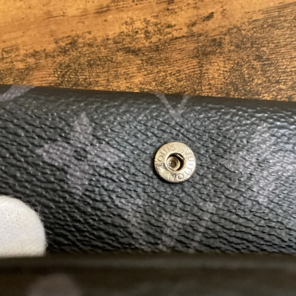 LV Discovery compact wallet Eclipse monogram tri fold